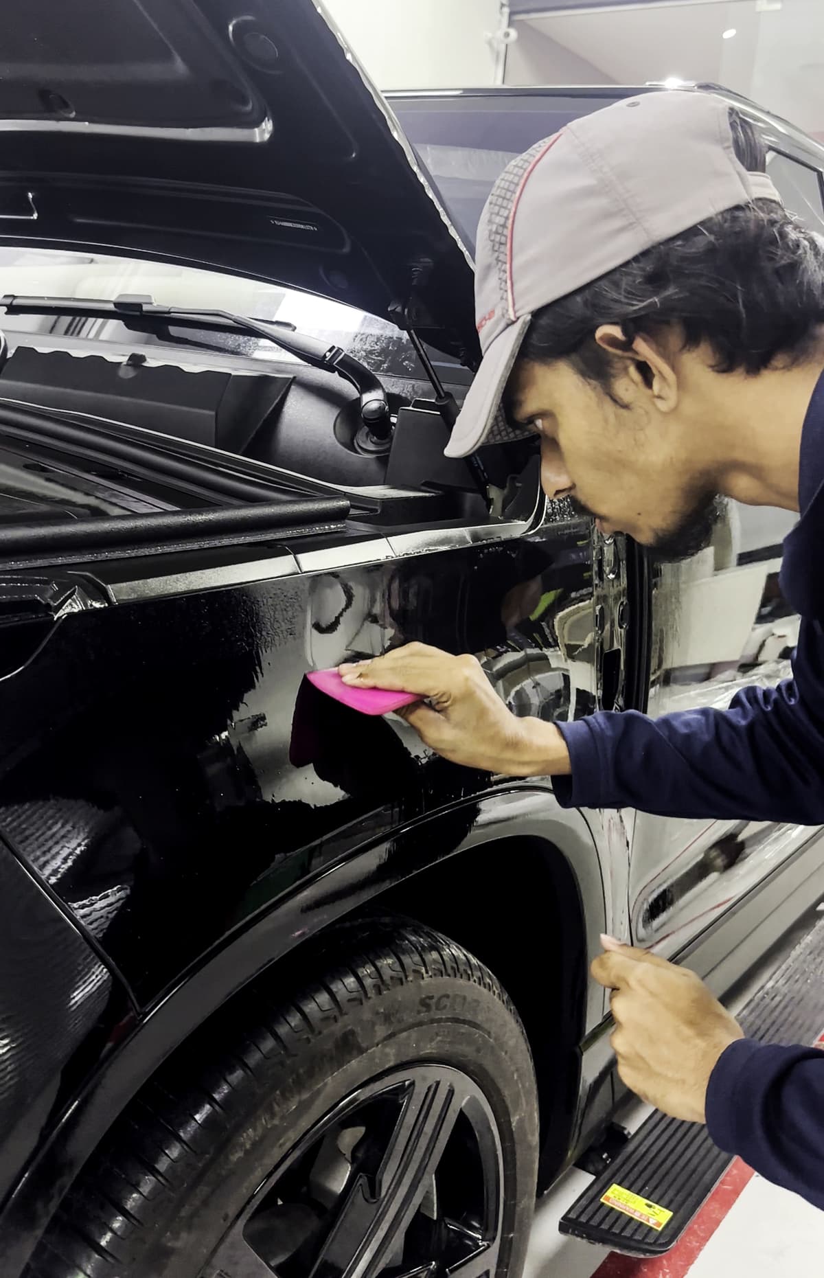 Car paint protection film being applied - full body PPF coverage